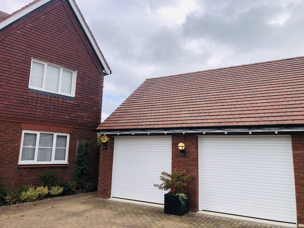 Twin White Roller Doors
